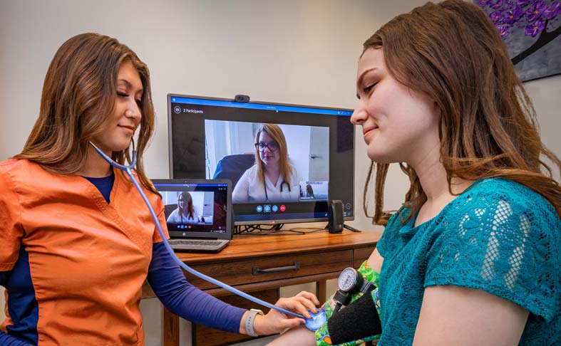Telehealth clinic providing distance healthcare in a rural clinic